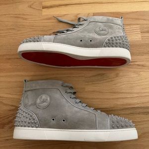 Christian Louboutin high top spike sneakers.